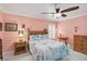 A quaint bedroom offers a relaxing space with neutral carpeting, wooden furniture, and ample natural light at 6615 12Th Ave W W Ave, Bradenton, FL 34209