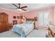 Cozy bedroom featuring nautical-themed decor, a ceiling fan, and comfortable furnishings at 6615 12Th Ave W W Ave, Bradenton, FL 34209