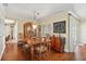 Elegant dining room with hardwood floors, a wooden dining table, and a display cabinet at 6615 12Th Ave W W Ave, Bradenton, FL 34209