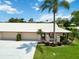 Charming home featuring a two-car garage, manicured lawn, and well-kept landscaping at 6615 12Th Ave W W Ave, Bradenton, FL 34209