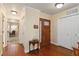 Inviting foyer featuring hardwood floors, an elegant front door, and a glimpse into the living spaces at 6615 12Th Ave W W Ave, Bradenton, FL 34209