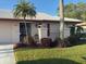 Charming single-story home with a well-maintained front yard and security door at 6615 12Th Ave W W Ave, Bradenton, FL 34209