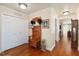Hallway with hardwood floors, a coat closet, and a charming wooden hall tree with hat racks at 6615 12Th Ave W W Ave, Bradenton, FL 34209