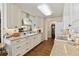 Bright kitchen with white cabinets, granite countertops, and stainless steel appliances at 6615 12Th Ave W W Ave, Bradenton, FL 34209