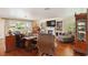 Cozy living room featuring hardwood floors, a fireplace, and built-in bookshelves for storage and decor at 6615 12Th Ave W W Ave, Bradenton, FL 34209