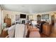 Bright living room with a fireplace, built-in bookshelves, and comfortable seating arrangements at 6615 12Th Ave W W Ave, Bradenton, FL 34209