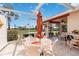 Enclosed patio with an outdoor dining area, offering views of the lush community landscaping at 6615 12Th Ave W W Ave, Bradenton, FL 34209