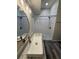 Bathroom showcasing a shower stall, modern vanity, decorative lighting, and a vessel sink at 6711 Cambridge Park Dr, Apollo Beach, FL 33572