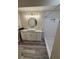 Modern bathroom with updated vanity, decorative tile shower, and modern lighting fixtures at 6711 Cambridge Park Dr, Apollo Beach, FL 33572