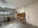 Spacious garage with tool bench, storage, and ample room for vehicles at 6711 Cambridge Park Dr, Apollo Beach, FL 33572