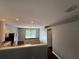 Well-lit kitchen with modern appliances and breakfast bar overlooking the living room at 6711 Cambridge Park Dr, Apollo Beach, FL 33572