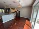 Bright kitchen with stainless steel appliances and dark wood floors at 6711 Cambridge Park Dr, Apollo Beach, FL 33572