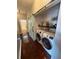 Hallway featuring a sliding barn door, laundry room with washer, dryer, and bathroom access at 6711 Cambridge Park Dr, Apollo Beach, FL 33572