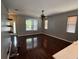 Comfortable living room with hardwood floors and large windows at 6711 Cambridge Park Dr, Apollo Beach, FL 33572