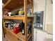 Basement storage area with wooden shelving and electrical breaker box at 6711 Cambridge Park Dr, Apollo Beach, FL 33572