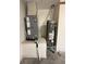 Utility room with modern furnace and hot water heater on an elevated service platform at 6711 Cambridge Park Dr, Apollo Beach, FL 33572