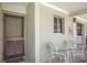 Entryway with chairs, a small table, door with keypad, and view of a laundry area at 7100 Gulf Dr # 114, Holmes Beach, FL 34217