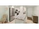 Kitchen with stainless steel appliances, white cabinets, and granite countertops at 7100 Gulf Dr # 114, Holmes Beach, FL 34217