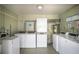 Functional community laundry room with multiple washers and dryers for resident convenience at 7100 Gulf Dr # 114, Holmes Beach, FL 34217