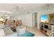 Spacious living area with comfortable seating, TV, and access to other rooms, perfect for relaxing or entertaining at 7100 Gulf Dr # 114, Holmes Beach, FL 34217