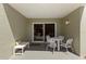 Relaxing patio with seating area, perfect for enjoying outdoor living with access via sliding glass doors at 7100 Gulf Dr # 114, Holmes Beach, FL 34217