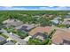 Aerial view showcases lush landscaping, screened pools, and well-maintained homes in a residential area at 750 Anna Hope Ln, Osprey, FL 34229