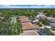Aerial view of residential homes with well-kept landscaping, pools, and screened-in enclosures at 750 Anna Hope Ln, Osprey, FL 34229
