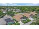 Overhead view of homes with swimming pools and screened lanais, surrounded by mature trees and landscaping at 750 Anna Hope Ln, Osprey, FL 34229