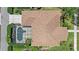 Overhead view of home with pool, lush landscaping, and screen enclosure at 750 Anna Hope Ln, Osprey, FL 34229