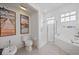 Bathroom with walk-in shower, separate tub, and stylish fixtures at 750 Anna Hope Ln, Osprey, FL 34229