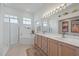 Bright bathroom featuring double vanity, large mirror, and separate tub with shower at 750 Anna Hope Ln, Osprey, FL 34229