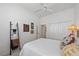 Bright bedroom features a ceiling fan and a closet with white paneled doors at 750 Anna Hope Ln, Osprey, FL 34229