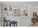 Open concept kitchen with a breakfast bar, modern appliances, neutral colored cabinets and ample counter space at 750 Anna Hope Ln, Osprey, FL 34229