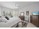 Comfortable main bedroom boasts ceiling fan, ample natural light, and cozy decor at 750 Anna Hope Ln, Osprey, FL 34229