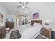 Inviting main bedroom with neutral decor, ceiling fan, and ample storage space at 750 Anna Hope Ln, Osprey, FL 34229