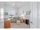 Bright office space features a sofa, side table, and large window with natural light at 750 Anna Hope Ln, Osprey, FL 34229