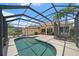Tranquil pool surrounded by a screened-in lanai, providing an ideal space for leisure and entertainment at 750 Anna Hope Ln, Osprey, FL 34229