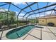 Inviting pool within a screened enclosure, complemented by lush landscaping and patio furniture at 750 Anna Hope Ln, Osprey, FL 34229