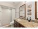 Cozy bathroom featuring a tiled shower, modern vanity, granite countertop, and updated fixtures at 7907 4Th W Ave # 7907, Bradenton, FL 34209