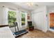 This bedroom offers a charming view of the outdoors, complemented by wood-look flooring and closet at 7907 4Th W Ave # 7907, Bradenton, FL 34209