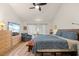 Comfortable bedroom with wood floors, a TV, and bright natural light at 7907 4Th W Ave # 7907, Bradenton, FL 34209