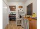 Hallway featuring a storage closet with view of dining area and living room at 7907 4Th W Ave # 7907, Bradenton, FL 34209