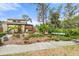 Charming exterior view of the Pine Bay Forest community, with lush landscaping and mature trees at 7907 4Th W Ave # 7907, Bradenton, FL 34209
