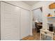 Hallway has a bi-fold door, wood-look flooring and is conveniently located near the dining area at 7907 4Th W Ave # 7907, Bradenton, FL 34209
