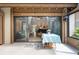 Covered patio featuring sliding glass doors that open to the airy living room at 7907 4Th W Ave # 7907, Bradenton, FL 34209