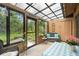 Charming sunroom with a view of lush greenery, perfect for relaxation and enjoying nature at 7907 4Th W Ave # 7907, Bradenton, FL 34209