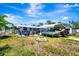 Spacious backyard with patio seating and covered boat storage at 997 28Th Avenue E Dr, Bradenton, FL 34208