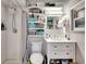 Bright bathroom featuring a shower, floating shelves, and updated vanity at 997 28Th Avenue E Dr, Bradenton, FL 34208