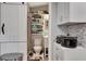 This is a small bathroom with open shelving and a white vanity at 997 28Th Avenue E Dr, Bradenton, FL 34208