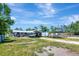 Exterior view of the home featuring a patio, and covered boat parking at 997 28Th Avenue E Dr, Bradenton, FL 34208